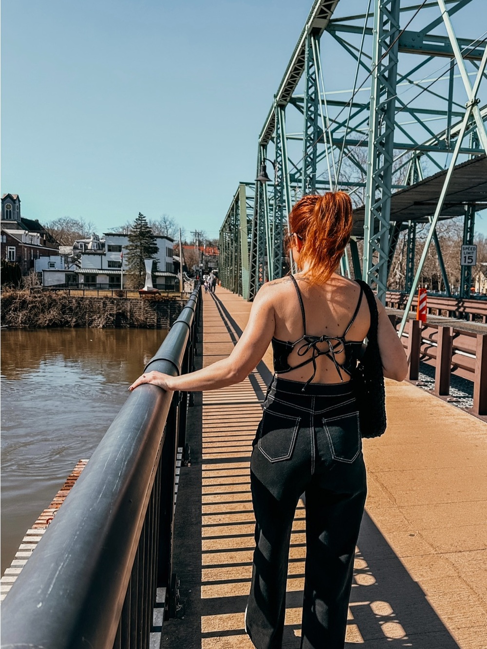 Womens denim jumpsuit with open tie back feature